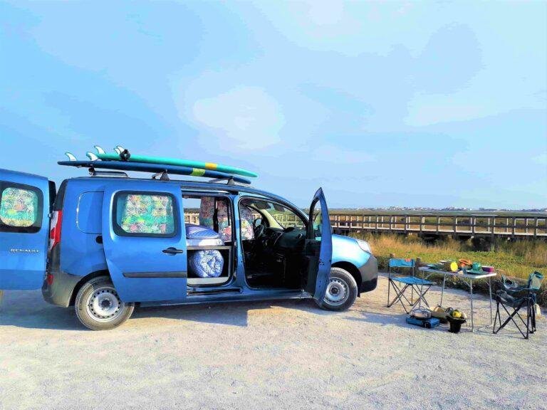 Blue Atlantic mini campervan parked on the beach with surfboards, Renault Kangoo Maxi XXL camper for sale in Portugal