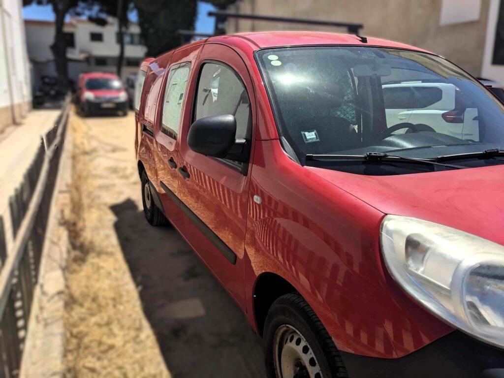 Side view of the red Renault Kangoo Maxi XXL mini campervan